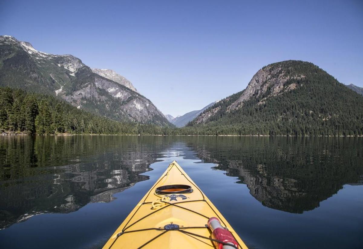 Paddling on Ross Lake, with Pumpkin Mountain at right, looking toward the saddle that contains Big Beaver Creek trail in North Cascades National Park. Lauren Danner, author of “Crown Jewel Wilderness,” a book about the creation of North Cascades National Park, will host a meet-the-author and book signing event at 7 p.m. Thursday at Browsers Bookshop in Olympia.