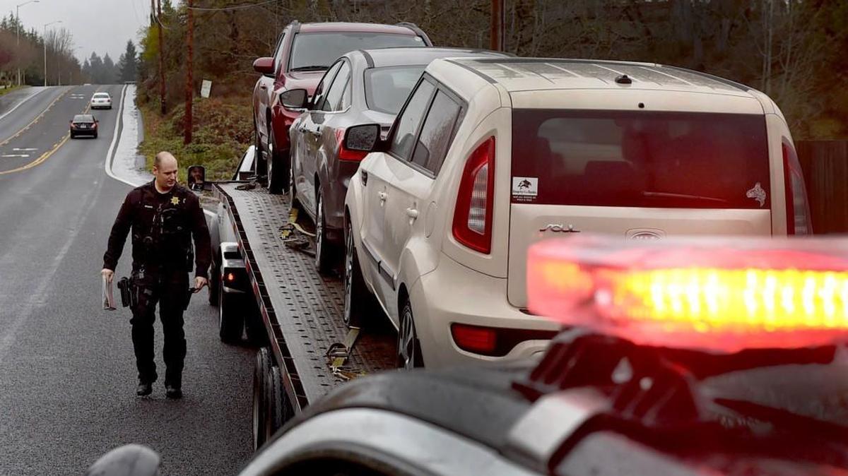 Thurston County sheriff’s Deputy Mike Brooks, who is trained in commercial vehicle inspection and enforcement, makes a routine stop-check last week along Marvin Road. The Board of County Commissioners has decided not to fully fund Sheriff John Snaza’s 2016 budget request.