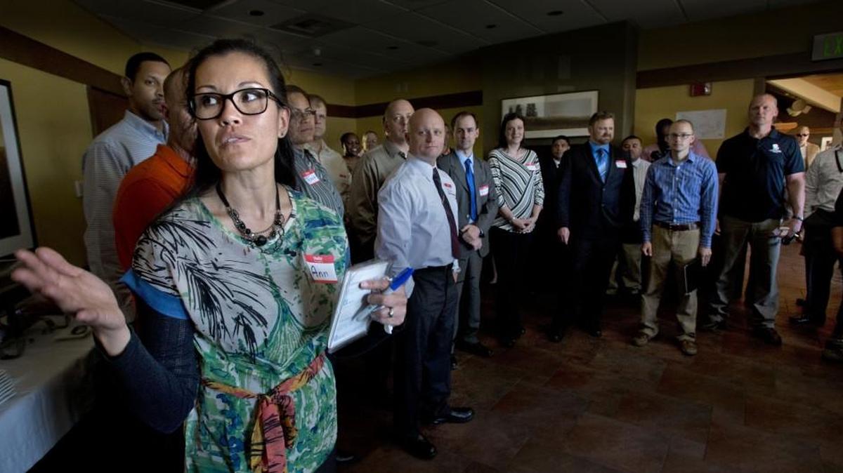 Northwest Edge instructor Ann Reiter, left, introduces soldiers to business recruiters during a job placement program at JBLM in 2014.