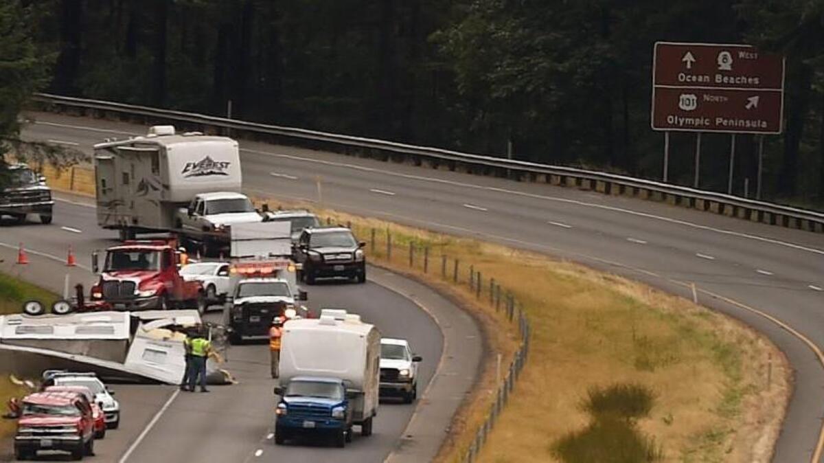 A rollover accident involving a pickup truck and trailer stopped southbound traffic Tuesday afternoon on U.S. 101 near Mud Bay. The rollover occurred around 1 p.m. The Olympia Fire Department reports that seven people were rescued from the crash. The accident blocked all southbound lanes for a time, creating a large overflow backup of traffic diverted to Madrona Beach Road near Steamboat Island Road.