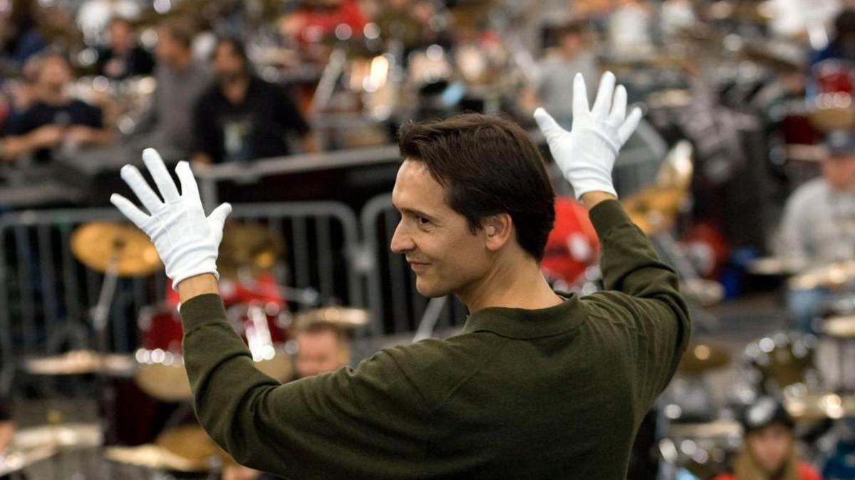 Christophe Chagnard, conductor with the Northwest Sinfonietta, leads hundreds of drummers gathered for the fifth annual Woodstick Guiness Record event in 2007 at the Puyallup Fair Events Center. Puyallup has settled a lawsuit around email discussions of giving Chagnard a key to the city.