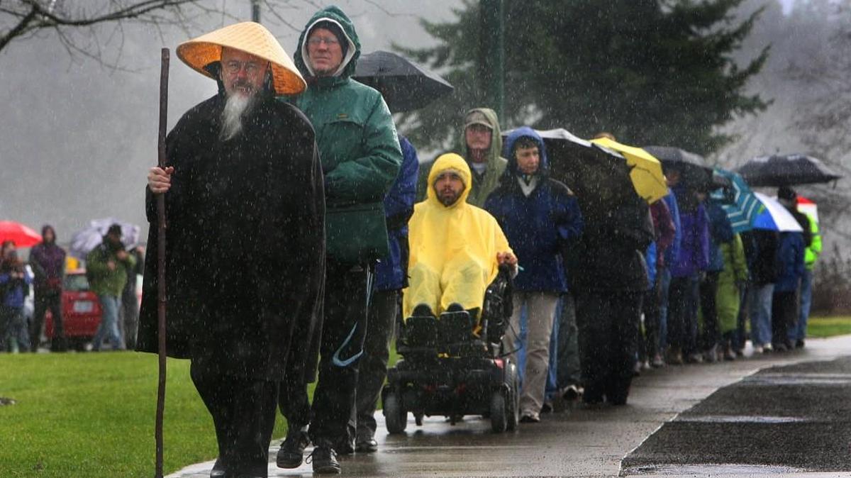 Koro Kaisan Miles, a Zen priest and resident teacher at Open Gate Zendo, leads a group of about 100 around Capitol Lake in 2011 as part of the annual silent Peace Walk. This year’s walk starts at noon Sunday at Marathon Park on the lake’s west side.