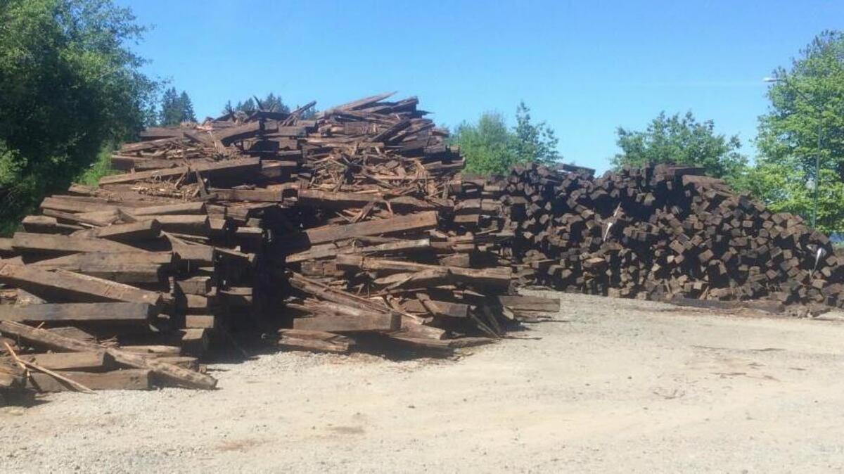 Old railroad ties have been piled up across from Marathon Park on Deschutes Parkway in Olympia, as seen Tuesday afternoon. Genessee and Wyoming Railroad is fixing the track and will have the debris removed by the end of this weekend, according to a representative from the company.
