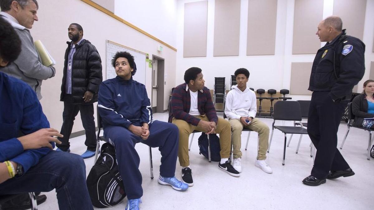 Participants gather for the city of Olympia public forum for the Ad Hoc Committee on Police and Community Relations at Olympia High School on Thursday. From left are Olympia High School Principal Matt Grant, Olympia High School paraeducator Antonio McClinon, Olympia High School students Malachi Horgdal, 16, Amir Matheney, 16, and Kardel Arnold, 15, Olympia police Lt. Aaron Jelcick and Black Hills High School student Madelaine Hendrickson, 18.