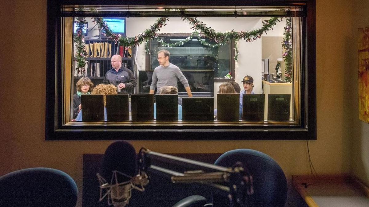 The news staff’s morning meeting as seen from a broadcast studio in the Seattle offices of KPLU. As of Wednesday afternoon Friends of 88.5 FM had raised $6,430,000, given by 17,000 individuals and businesses. When it reaches $6.5 million a matching $500,000 pledge will kick in.