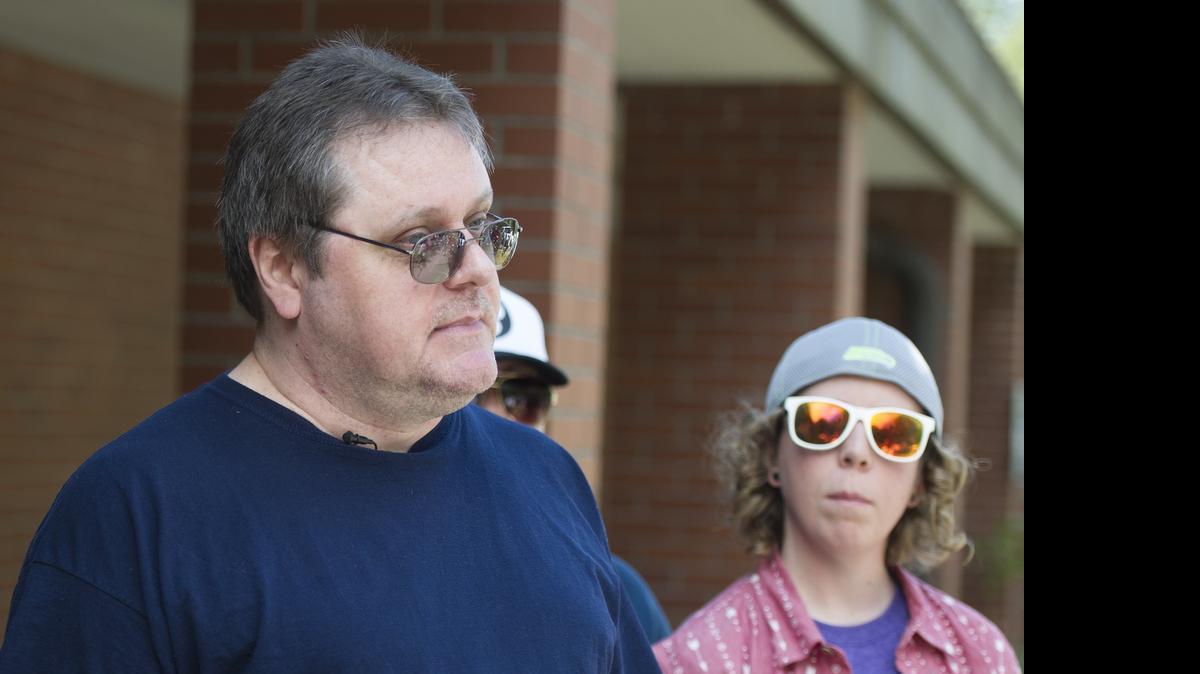 
David Veatch, father of Bellingham High student Autumn Veatch, 16, talks to the media Monday at the Civil Air Patrol station at Bellingham International Airport. Autumn Veatch, who was on a private plane that never reached Lynden on Saturday afternoon, was taken Monday to Three Rivers Hospital in Brewster after she was picked up by a motorist who drove her to safety. At right is Autumn's friend Chelsey Clark.
