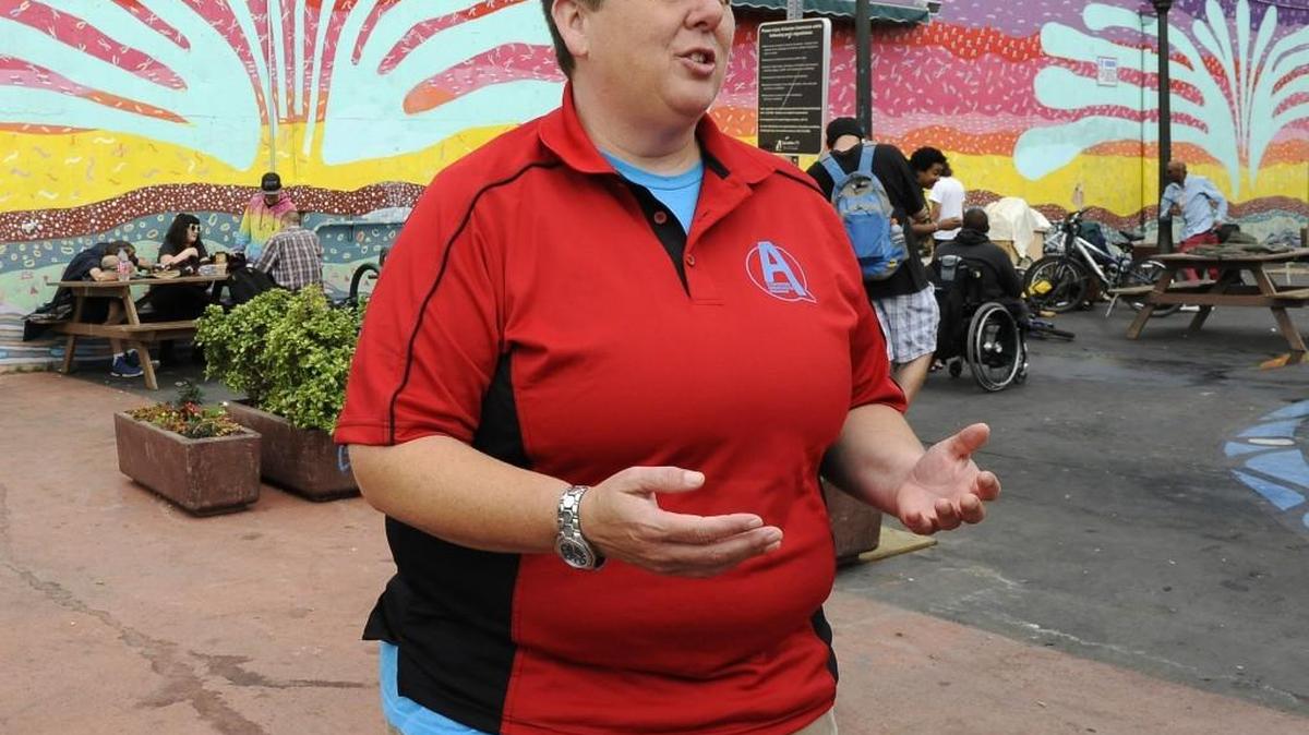 FILE PHOTO: As the program director for Olympia’s Downtown Welcome Center Sharon Holley has made it a personal goal to be highly visible and accessible, making regular stops to local public landmarks including the Artesian Well and Commons area.