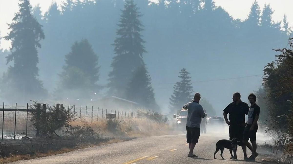 Local fires, such as this Aug. 2 brushfire near Rochester, added to the smoke in the air.