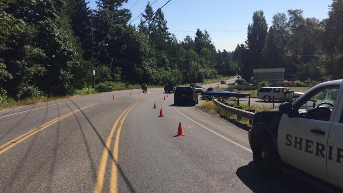 Thurston County Sheriff’s Office investigates a crash between a motorcycle and an SUV pulling a boat on Saturday, July 8, 2017.