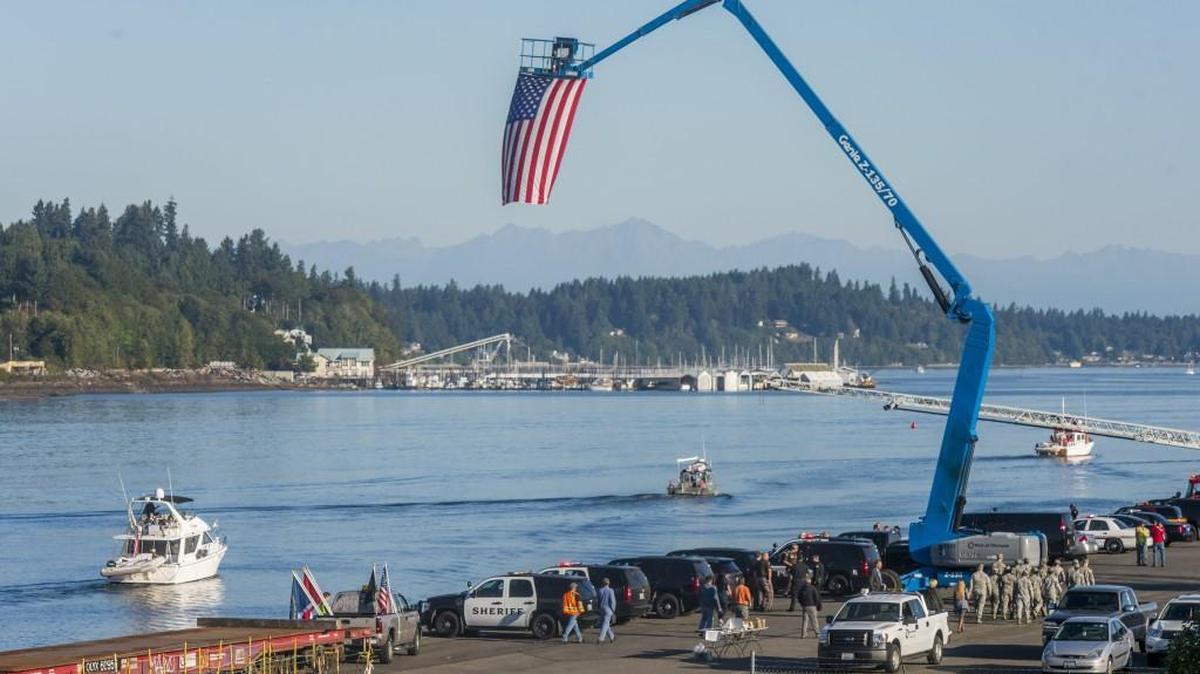 
First responders on the dock give a salute as boats from the Olympia Yacht Club head out Friday for the 53rd annual Foofaraw. The yacht club and Olympia Chamber took military personnel out for a day of boating, barbecue and games.
