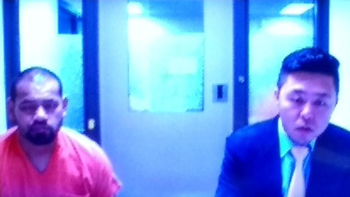 John Santos (left) is suspected in the shooting death of a 28-year-old man. He appeared Monday, Oct. 16, 2017 in Thurston County Superior Court with Public Defender Andrew Yi.