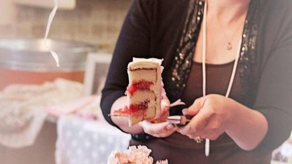 
Pastry chef Dana Bellefeuille, who judged four baking contests this year at the Washington State Fair in Puyallup, examines a cake. 
