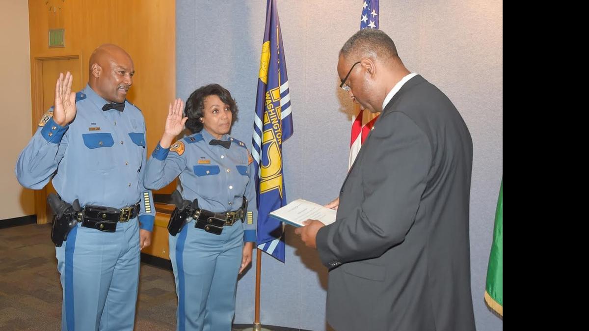 
Monica Alexander (center) became the first female African-American captain in the Washington State Patrol on Tuesday. She and her husband, Johnny Alexander (left), were both promoted to captain by Chief John Batiste.
