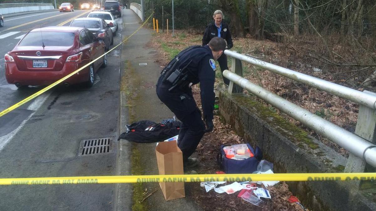 Olympia police officers investigate the scene of stabbing Wednesday afternoon on the Olympia Woodland Trail near Boulevard Road.
