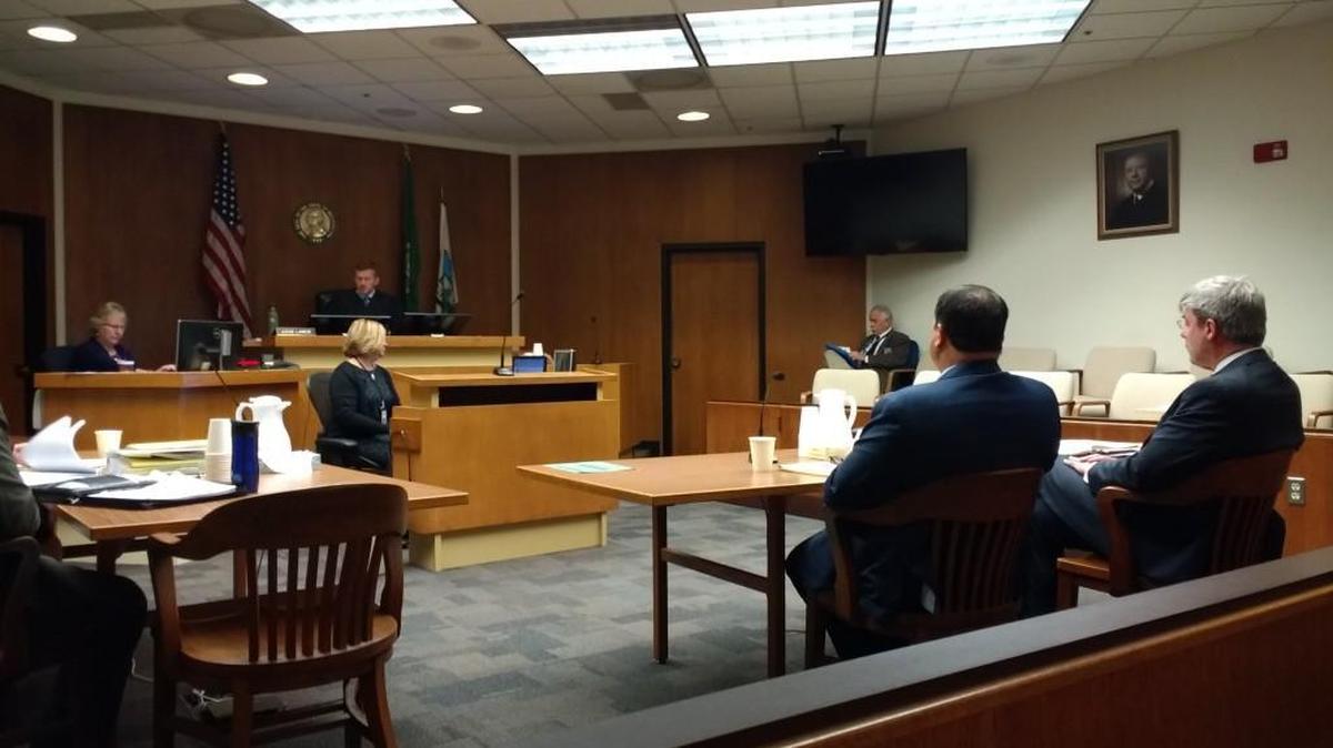 Jimmy Wall (second from right) appeared for trial Nov. 8 in Thurston County Superior Court. He is represented by attorney Wayne Fricke (right). The case is being heard by Judge Chris Lanese.