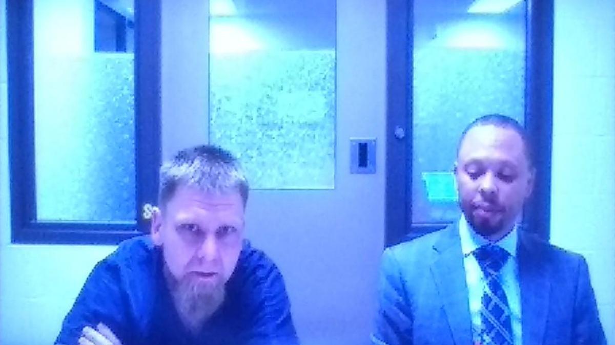 Travis D. Jackson (left) appeared via video conferencing in Thurston County Superior Court, on July 14, 2017. He is joined by Public Defender Larry Jefferson.