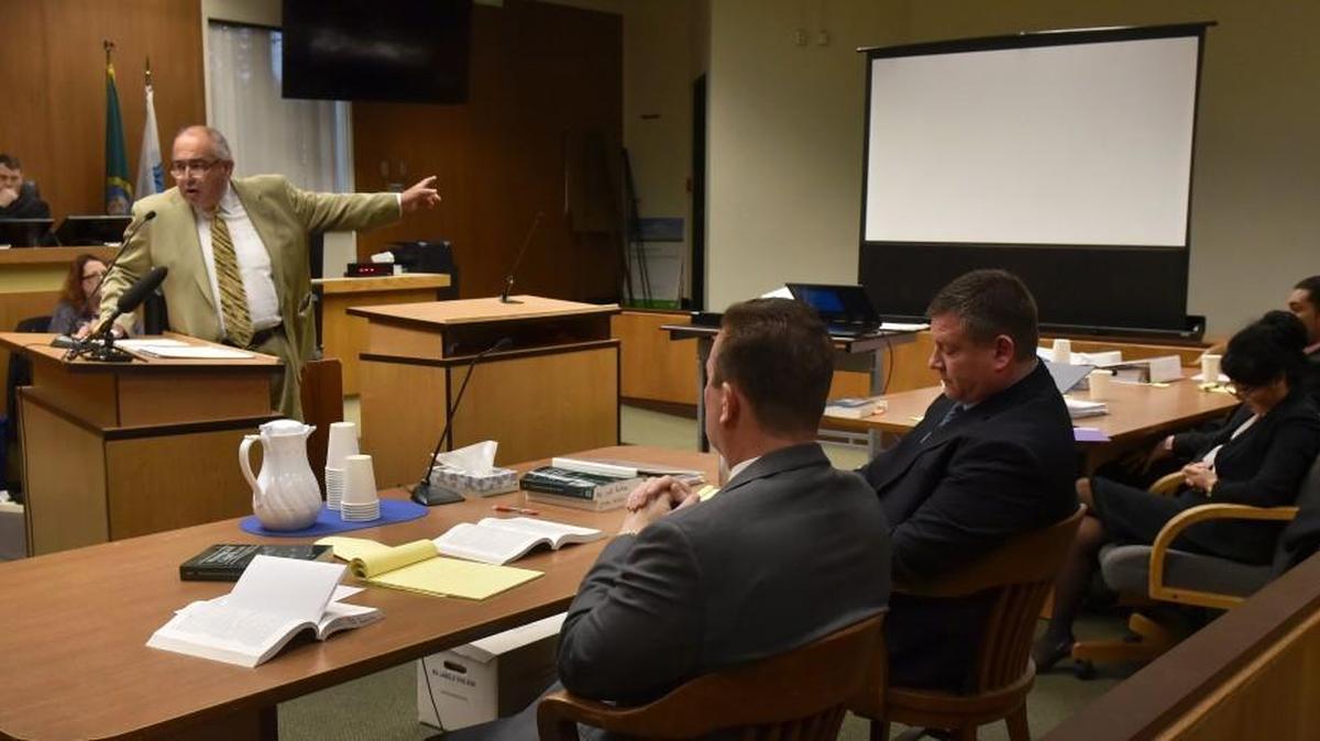 As Thurston County Superior Court Judge Judge Erik Price listens defense attorney George Trejo addresses the jury during opening statements' phase March 29.
