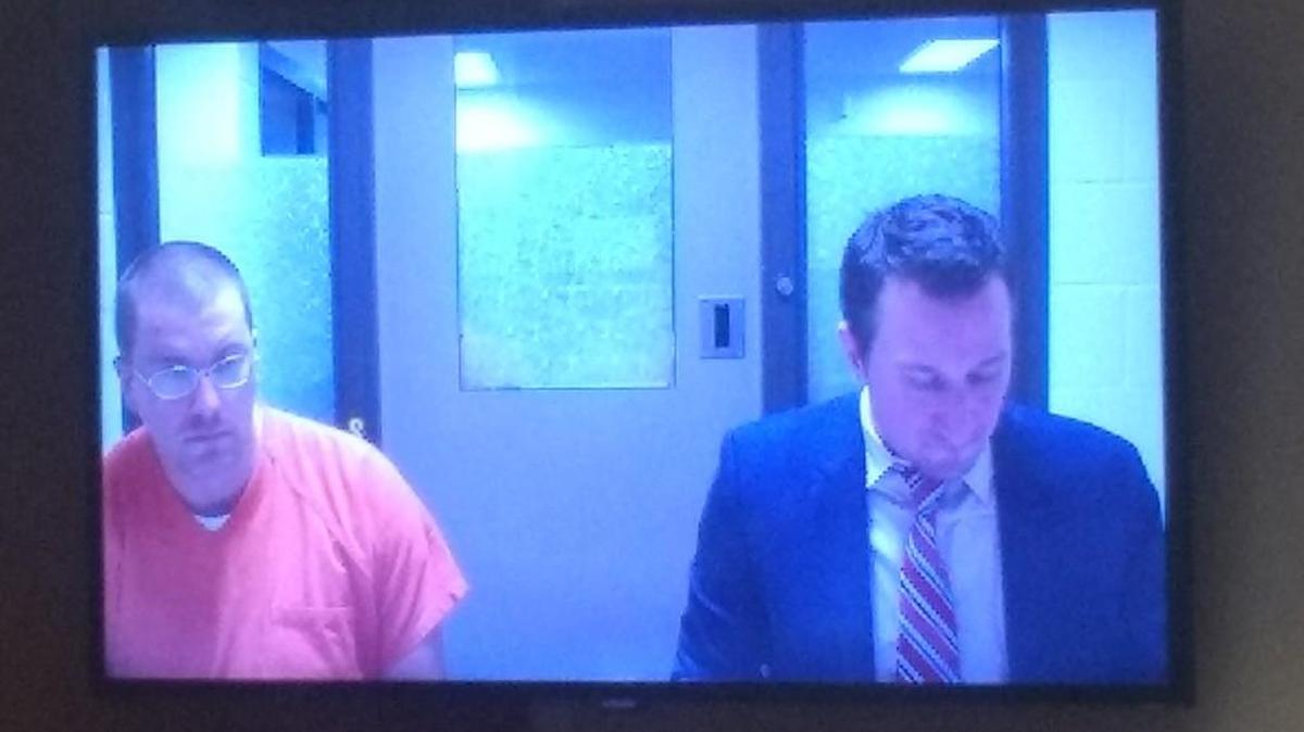 Karl W. Shanabarger (left) is accused of shooting a cat with a crossbow. He appeared Thursday, Dec. 7, 2017 in Thurston County Superior Court with Public Defender Eric Pilon.