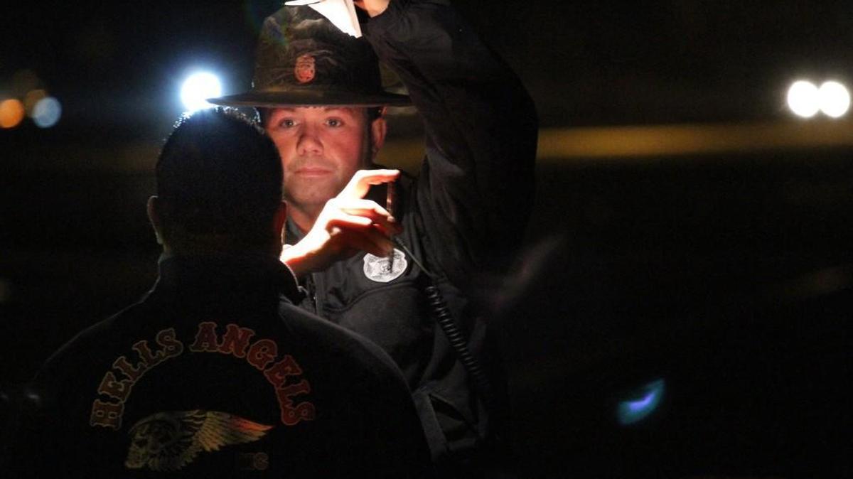 Washington State Patrol Trooper Guy Gill performs a field sobriety test on the side of Interstate 5 on Dec. 22, 2012.