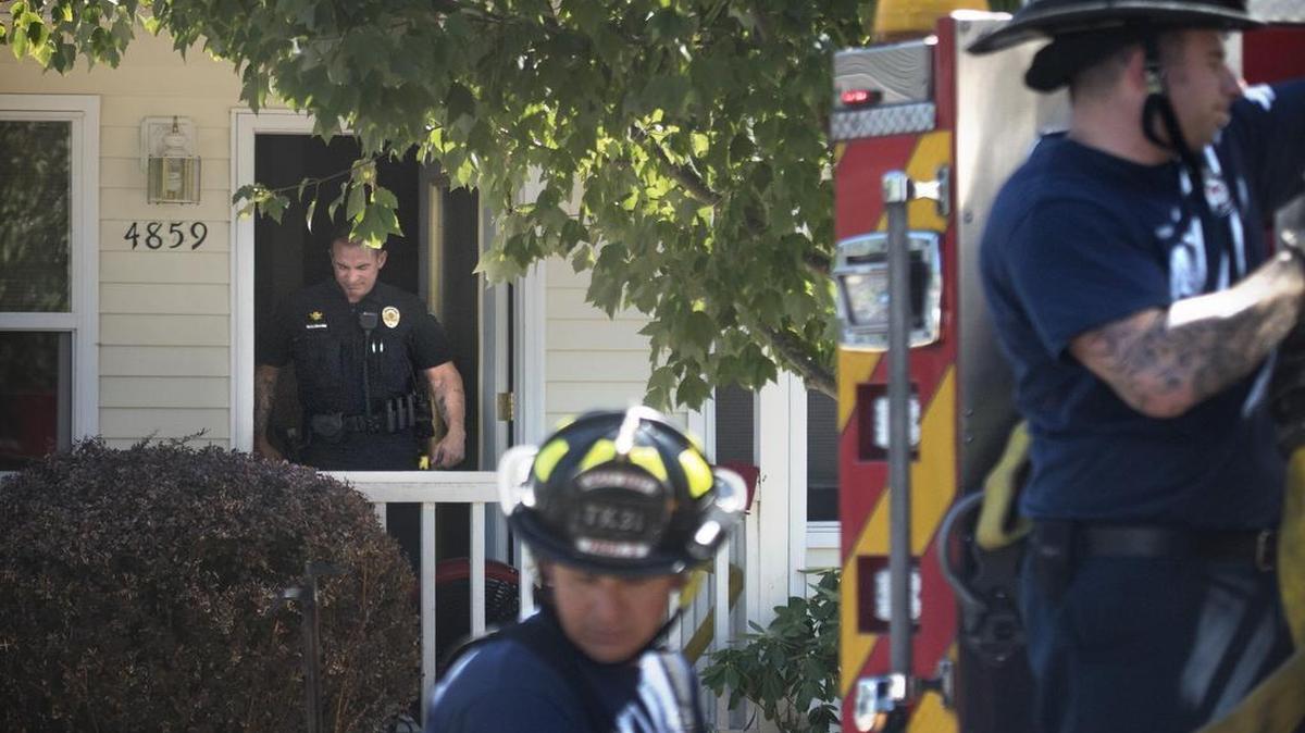 
As Lacey firefighters wrap up their hoses, Lacey police investigate a domestic violence call on 42nd Lane in Lacey on Friday. While police were responding to the address, a fire started in the home's garage, prompting a firefighter response, as well.
