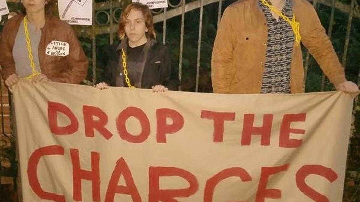 
This photo was posted Thursday night on Twitter and shows protesters chained to the fence outside Thurston County Prosecutor Jon Tunheim’s home in the Steamboat Island area.
