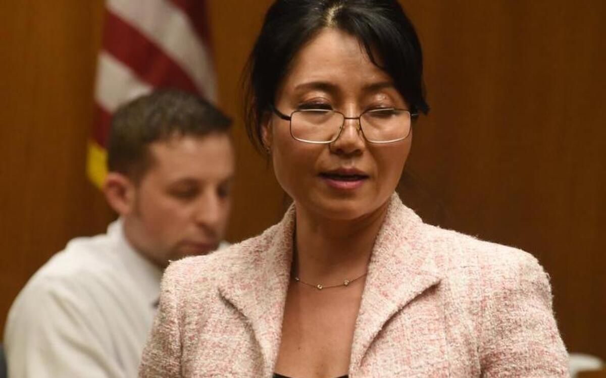 Defense attorney Sunni Ko stands Thursday in front of Olympia police Officer Ryan Donald in Thurston County Superior Court.