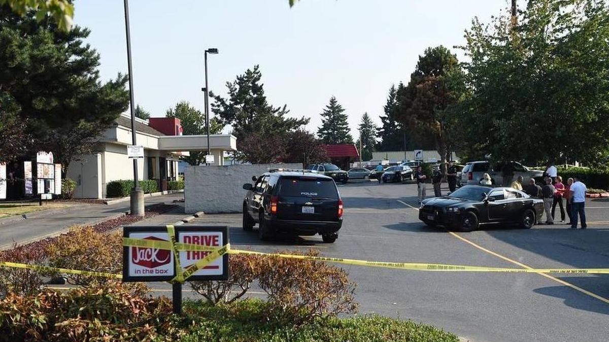 
A multi-agency, law enforcement response team investigates the officer-involved shooting at the Trosper Road Jack in the Box restaurant Aug. 18th after Tumwater police responding to a reported 4:30pm hostage incident shot one suspect ,who was then transported to the Harborview Medical Center in Seattle. Tumwater police said Wednesday morning that he is in critical-but-stable condition.

