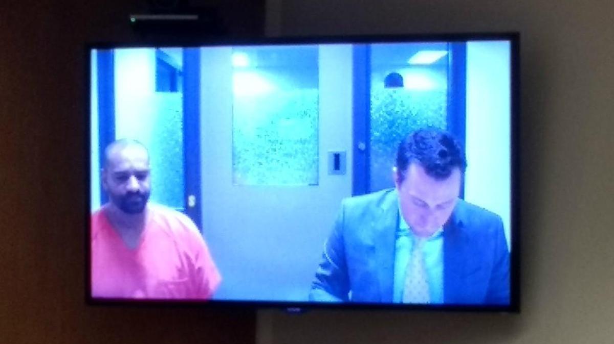 Jamel Soliman (left) appears with public defender Eric Pilon via video conferencing in Thurston County Superior Court on Monday, April 24, 2017. Soliman is suspected of shooting another man in Tumwater.