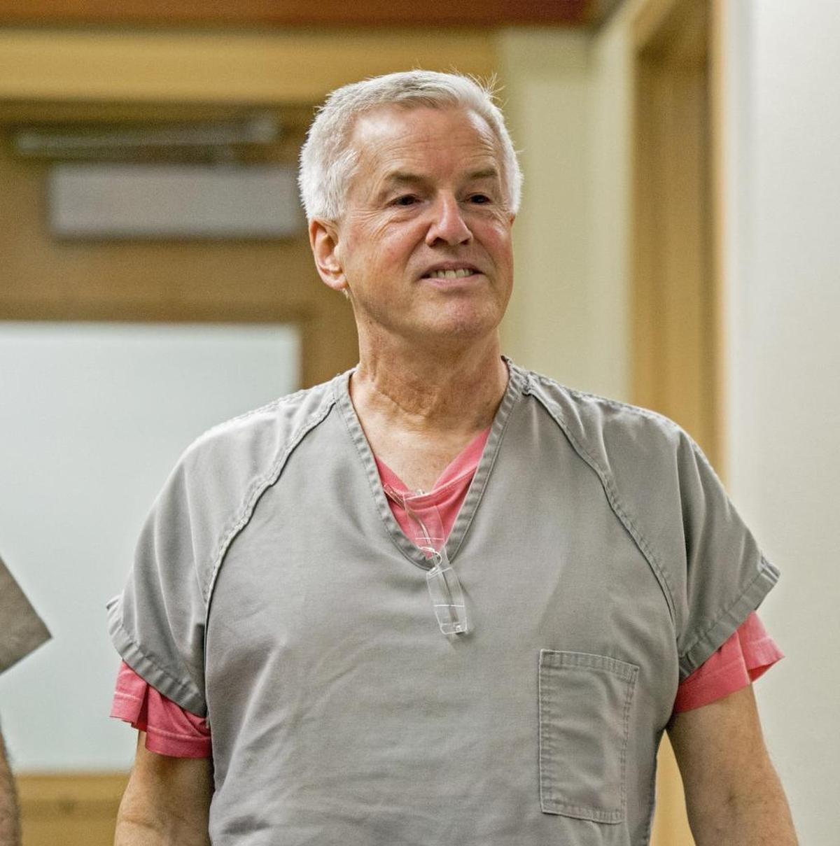 Steven Craig Powell enters Pierce County Superior for an arraignment on charges of possessing child pornography, October 28, 2014.