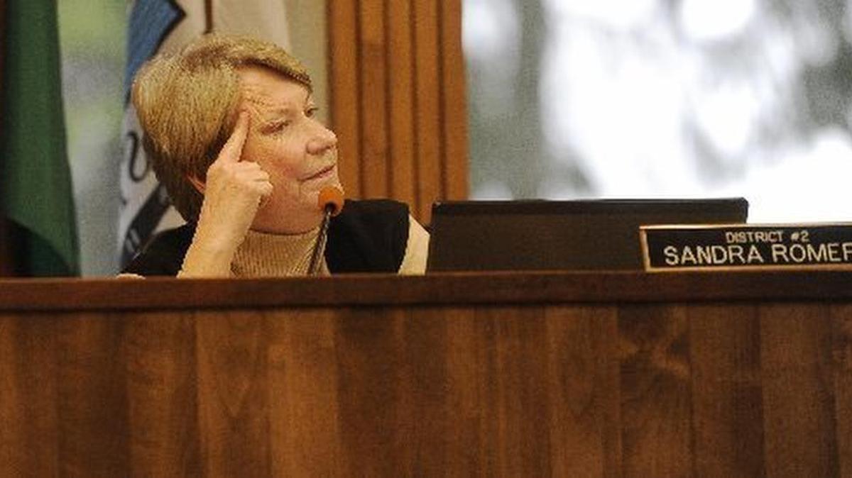 Olympian file photo: Thurston County Commissioner Sandra Romero listen to comments at the commission’s Dec 7 budget hearing. She has announced that she won’t seek a third term on the board this fall.