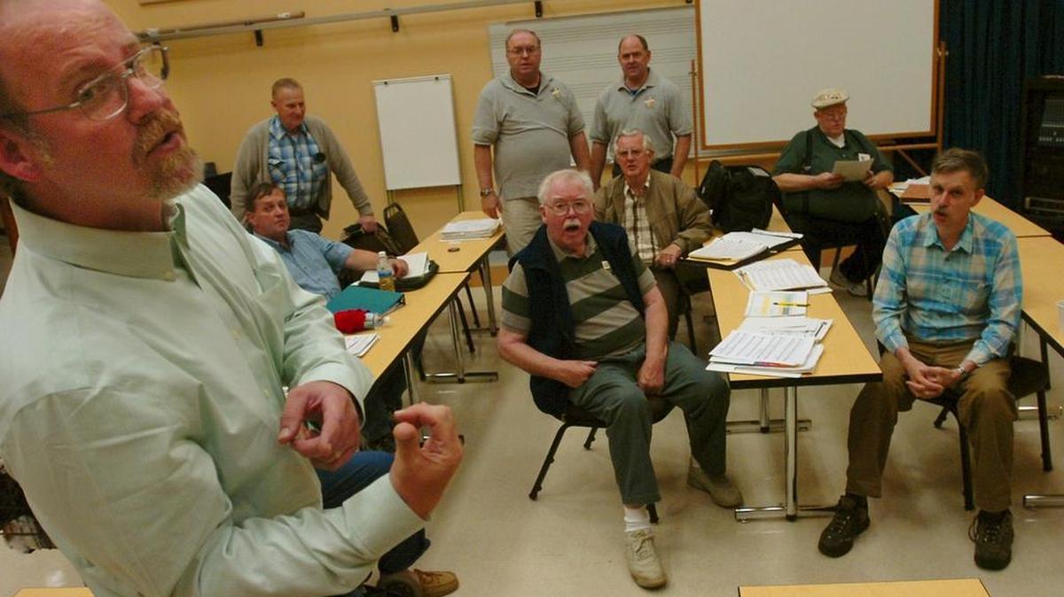 Filling in as director during their regular practice session Mickey Nelson leads his fellow Puget Sounders Barbershop Chorus singers at South Puget Sound Community College's Performing Arts Center. Steve Bloom/The Olympian