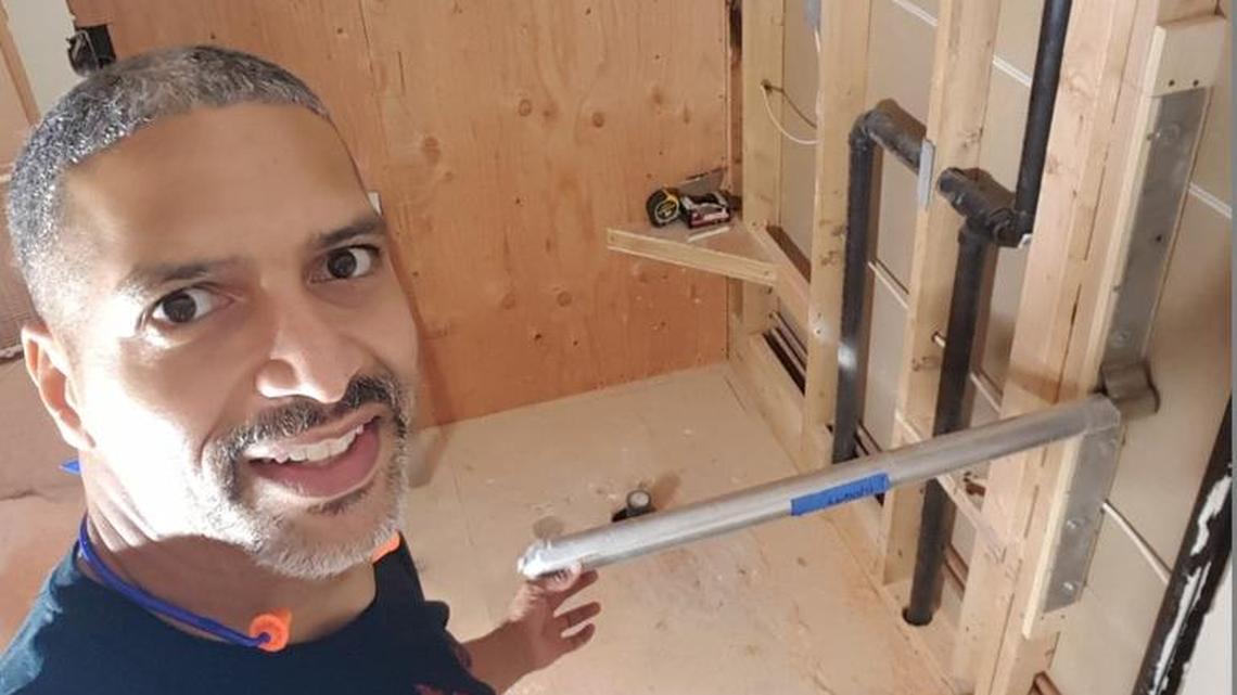 James McLurkin created a solution to a common problem: The way most bathrooms are laid out, there is no good place to put a towel where someone in the shower can reach it. The answer: “The shower will be in the back of the picture. The cardboard on the floor shows the outline of the tub. So you can get your towel from either location. Mischief managed.”