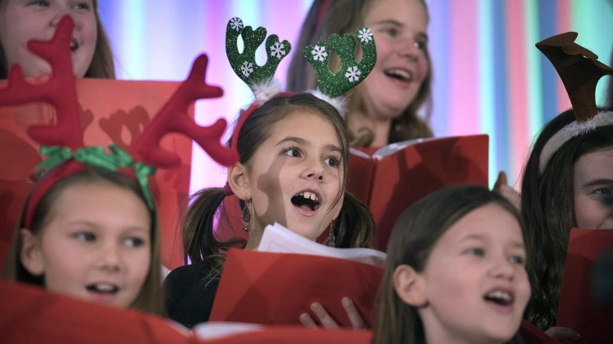 Students from the Michael T. Simmons Elementary School choir perform holiday songs during the 2015 Tumwater Christmas Tree Lighting Festival at the Tumwater Fire Department.