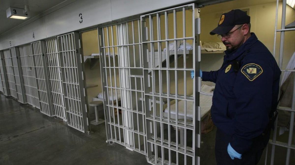 Washington Corrections Center Sgt. Larry Reeves opens a cell block door during a 2011 tour of the Shelton facility.