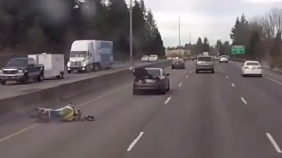 Bill’s Towing and Recovery in Yelm posted gripping video footage of a motorcyclist rear-ending a vehicle, then hanging on for a ride Monday on northbound Interstate 5 in Tumwater.