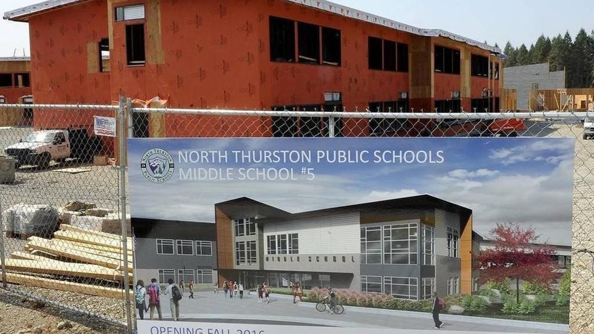 
An artist’s rendering of the new middle school is displayed prominently near the street entrance in August 2015. The North Thurston School Board approved a new name for the school during its meeting on Tuesday night. 
