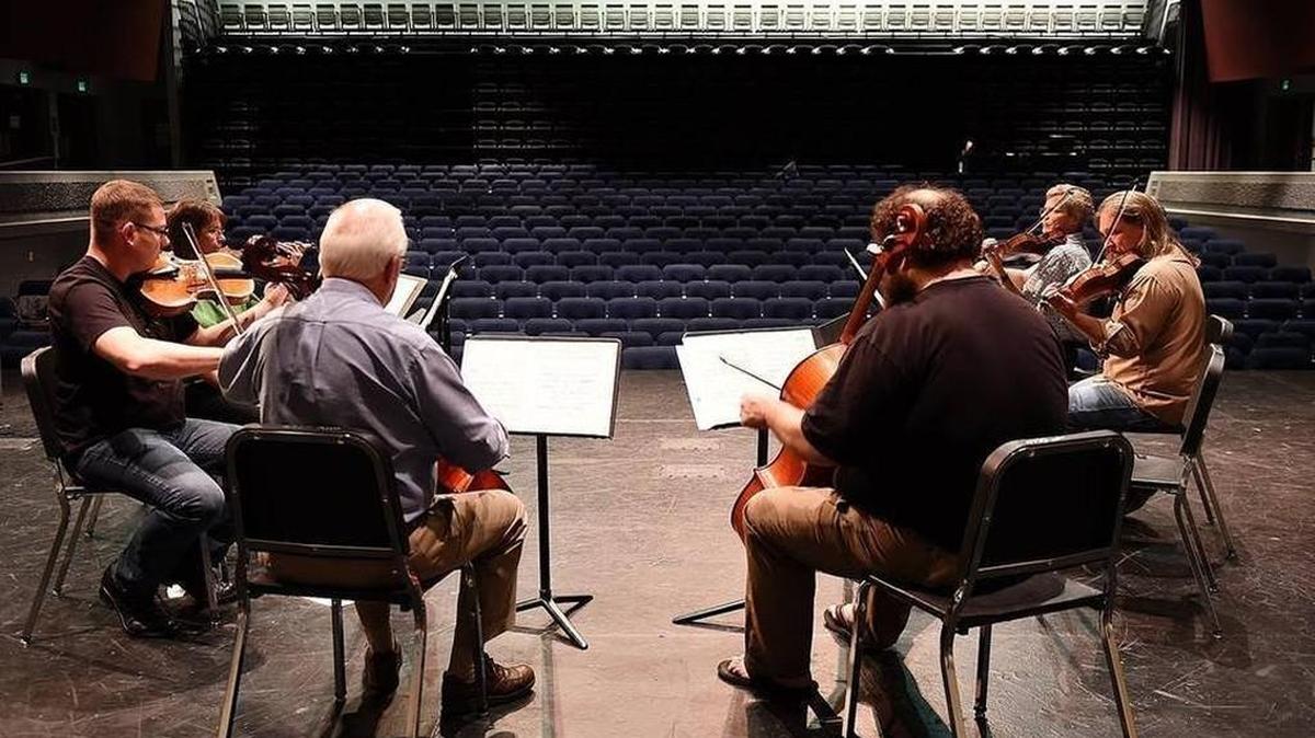 Staff file: North Thurston Public Schools orchestra teachers, from left, Tonni Johnston, Chad Hocutt, Ian Edlund, Joe Sokolik, Brent Pearson and Grant Sears rehearse for the 2015 recital at the Koval Center for the Performing Arts. Teachers in the district will perform again on Thursday for a benefit concert.