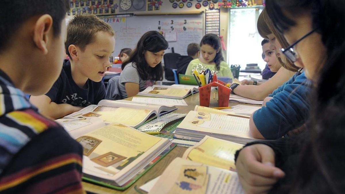 File, 2015: Black Lake Elementary School student Nathaniel Donaway (second from left) takes his turn during teacher Teresa Davenport’s team reading assignment. The Tumwater School Board is trying to fill a vacancy for its Director District No. 4, which represents neighborhoods around Black Lake Elementary and Black Lake High schools.