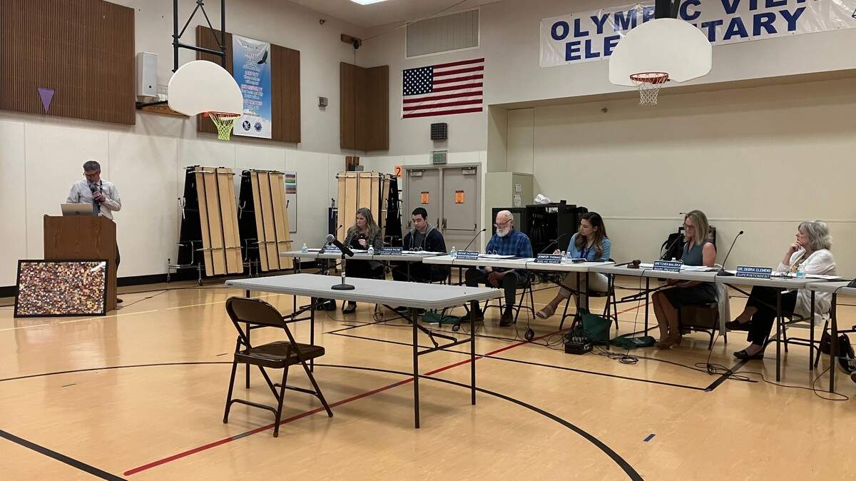 Assistant Superintendent of Operations Troy Oliver (far left) explains elementary school boundary recommendations to the North Thurston Public Schools board at Olympic View Elementary on Tuesday.
