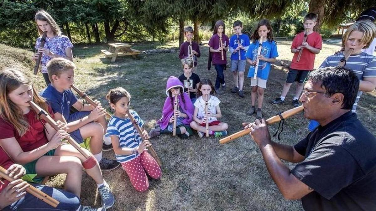 Staff file photo: Peter Ali, right, a flute instructor at the Northwest Indian College on the Lummi reservation, improvises a song with students on their Plains Indian-style flutes at the Olympia Waldorf School on Friday, Sept. 10, 2014. The private school is one of more than 20 that plan to participate in the Olympia Area Alternative School and Preschool Fair on Saturday.