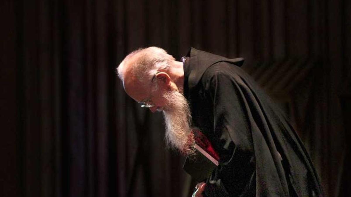 Father Alfred Hulscher enters the 2014 Good Friday service. In the mid-1950s, he applied to join the monastery after attending four years at Saint Martin’s High School and two years at its college. He died Thursday evening after about a week in hospice care.