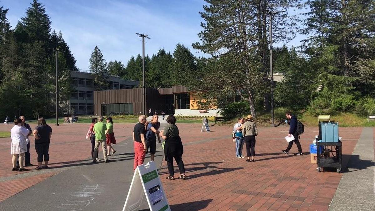 Staff and faculty at The Evergreen State College were out welcoming students to campus Wednesday morning with coffee and conversation, in this photo tweeted by the college. Meanwhile, some faculty were holding classes and meeting with students off campus due to safety concerns.