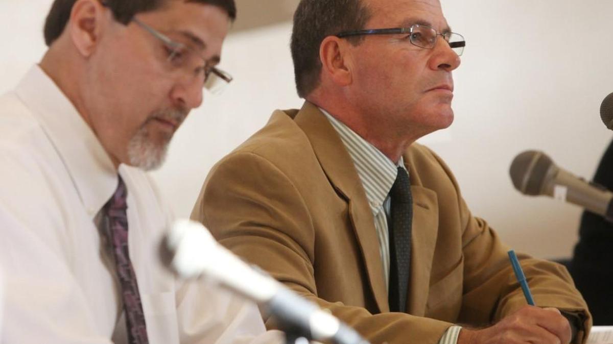 Olympian file photo: Olympia School District Superintendent Dick Cvitanich (right) and board member Mark Campeau listen to public testimony in support of reinstating ousted Capital High School boys basketball coach Doug Gallkoway in the Madison Elementary School gymnasium in 2012. The district said it’s investigating a data breach; someone posing as Cvitanich obtained personal information of employees on Tuesday, officials say.