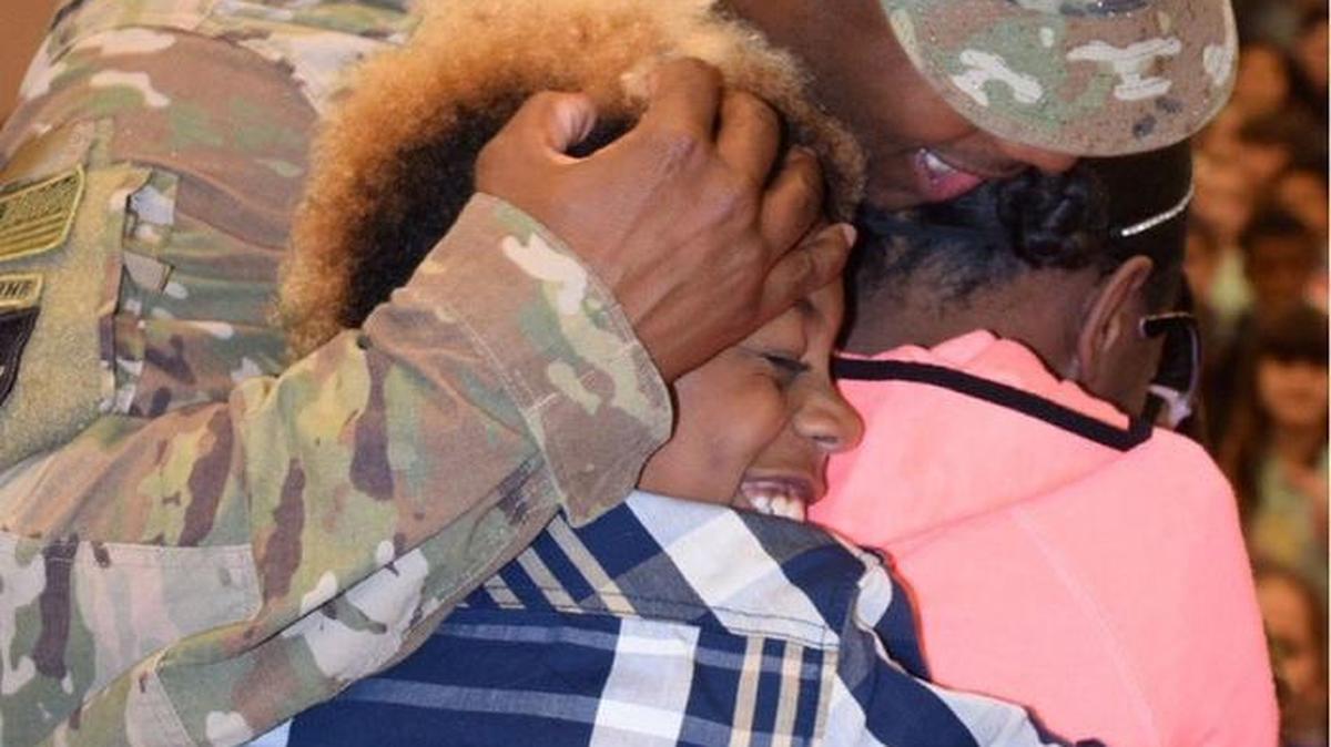 Staff Sgt. Latavis Walker made a surprise homecoming during the Veterans Day assembly at McKenny Elementary School in Olympia on Thursday.
