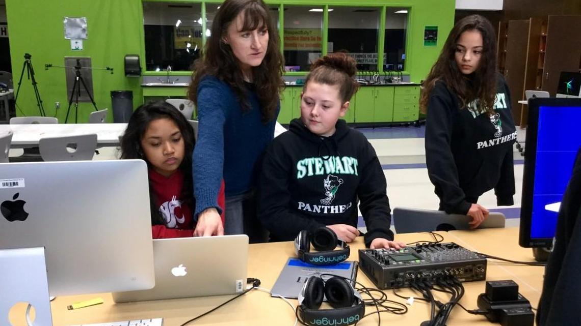 Students at Tacoma’s Stewart Middle School learn digital video production skills from teacher Teri Harris in their new studio. From left, the students are Nelisa An, Maryjane Valdes and Ayanna Molinero.