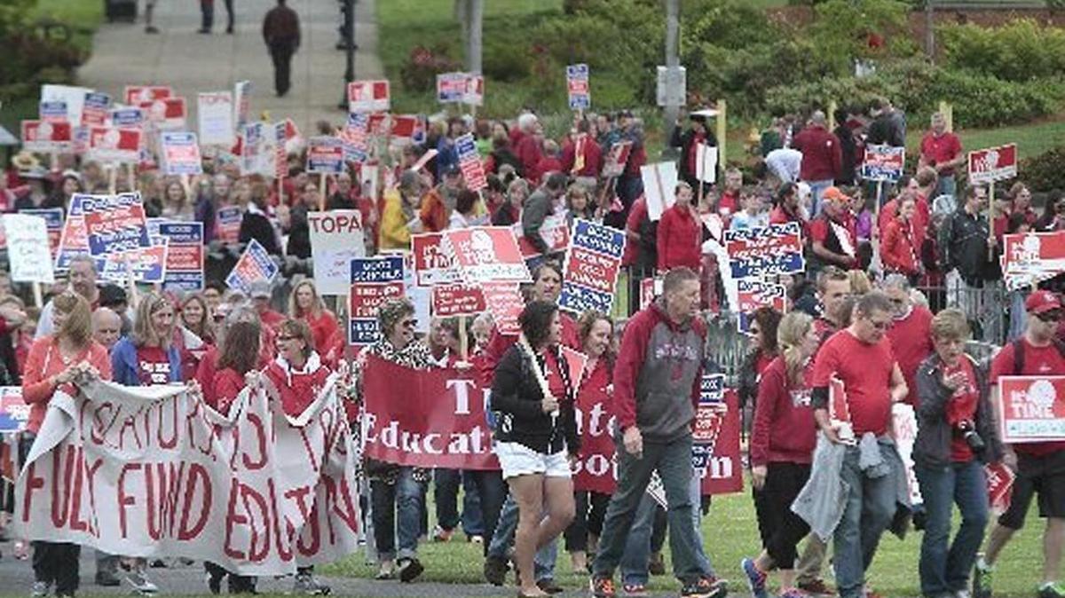FILE PHOTO: About 400 Tumwater teachers, staff, students and supporters marched across the Capitol Campus in Olympia during a one-day strike to protest the legislature’s inability to meet court-ordered education funding last May.