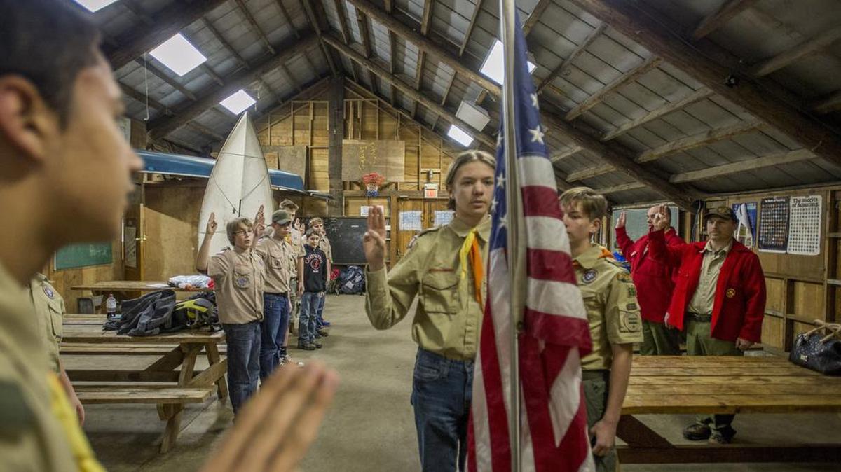 Members of Boy Scout Troop 692 recite the Scout Oath at the beginning of their weekly meeting in the lodge at Camp Curran near Canyon Road. Pacific Harbors Council of Boy Scouts of America plans to close the camp.