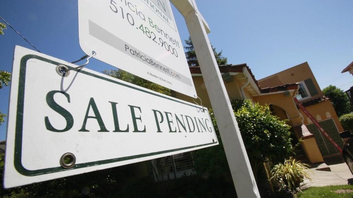 In a file photo, a Sale Pending sign is attached to this property in Oakland, Calif.