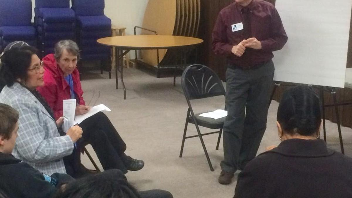 Curt Pavola of the Ad Hoc Committee on Policing and Community Relations leads one of three breakout discussion groups Dec. 7 at First Christian Church in downtown Olympia.