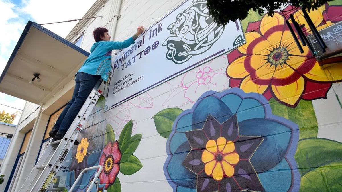 
Primeval Ink Tattoo co-owner Suzanne Shepherd is about 75 percent done painting a mural, she said last week, on the side of her studio in downtown Olympia. She plans on having the mural at 301 Fifth Ave. SE completed in time for this weekend’s fall Arts Walk. 
